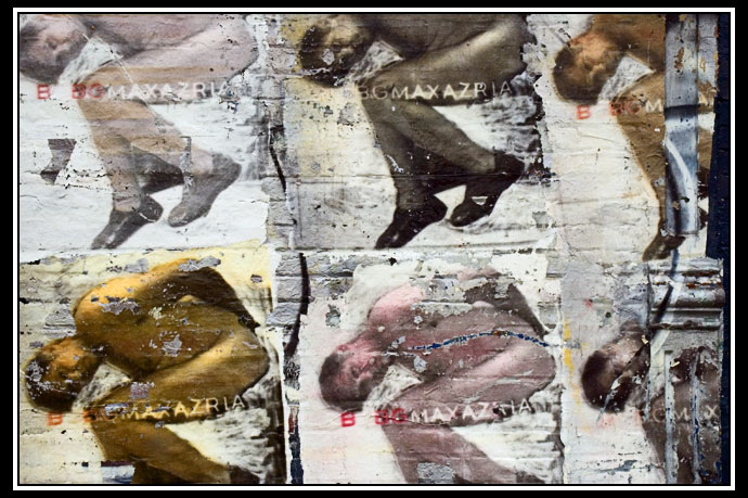 brick wall with posters