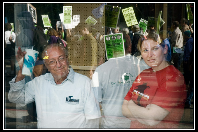march reflected in window