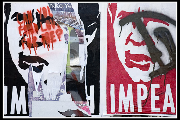 torn poster and grafitti